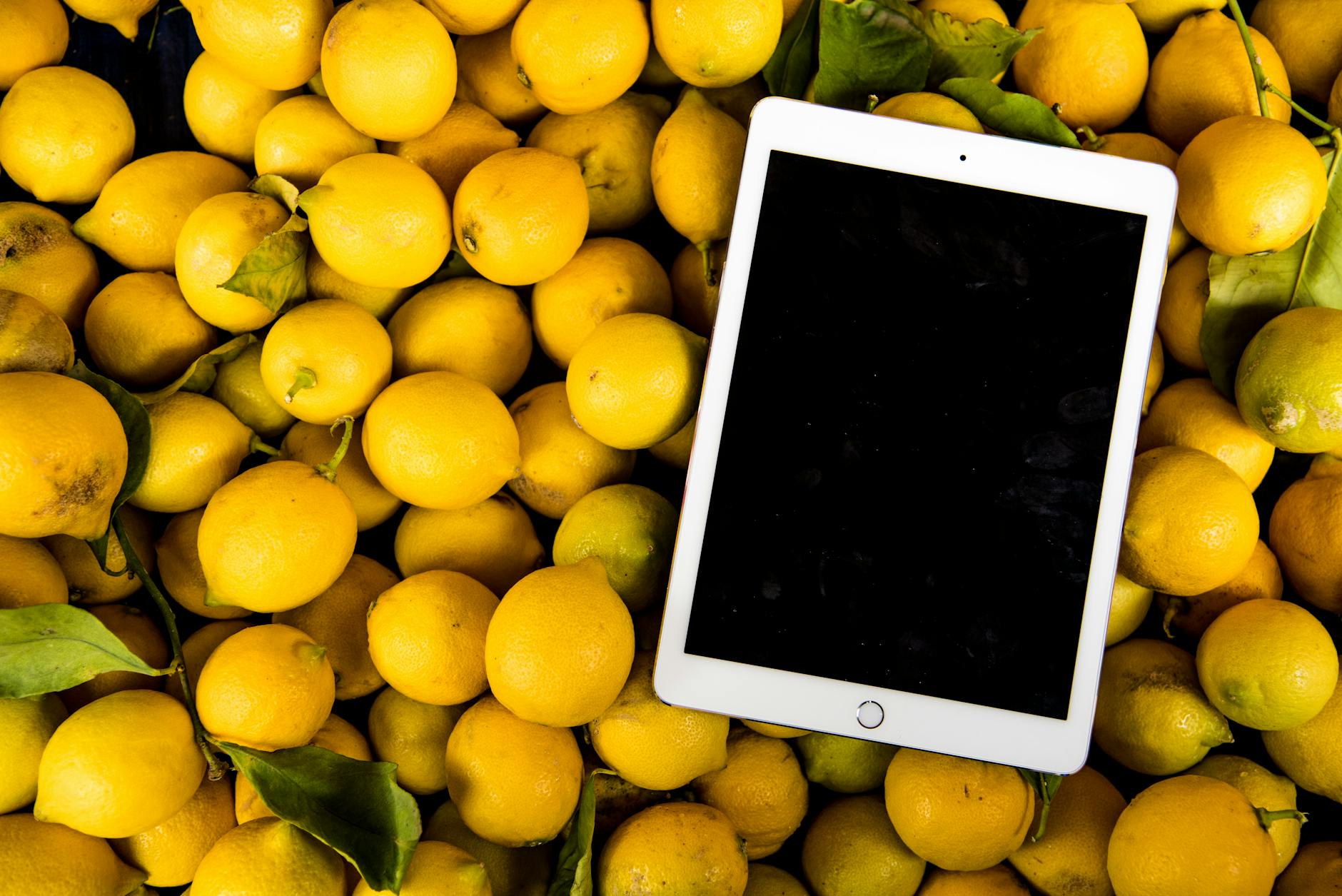 photo of ipad on pile of lemons